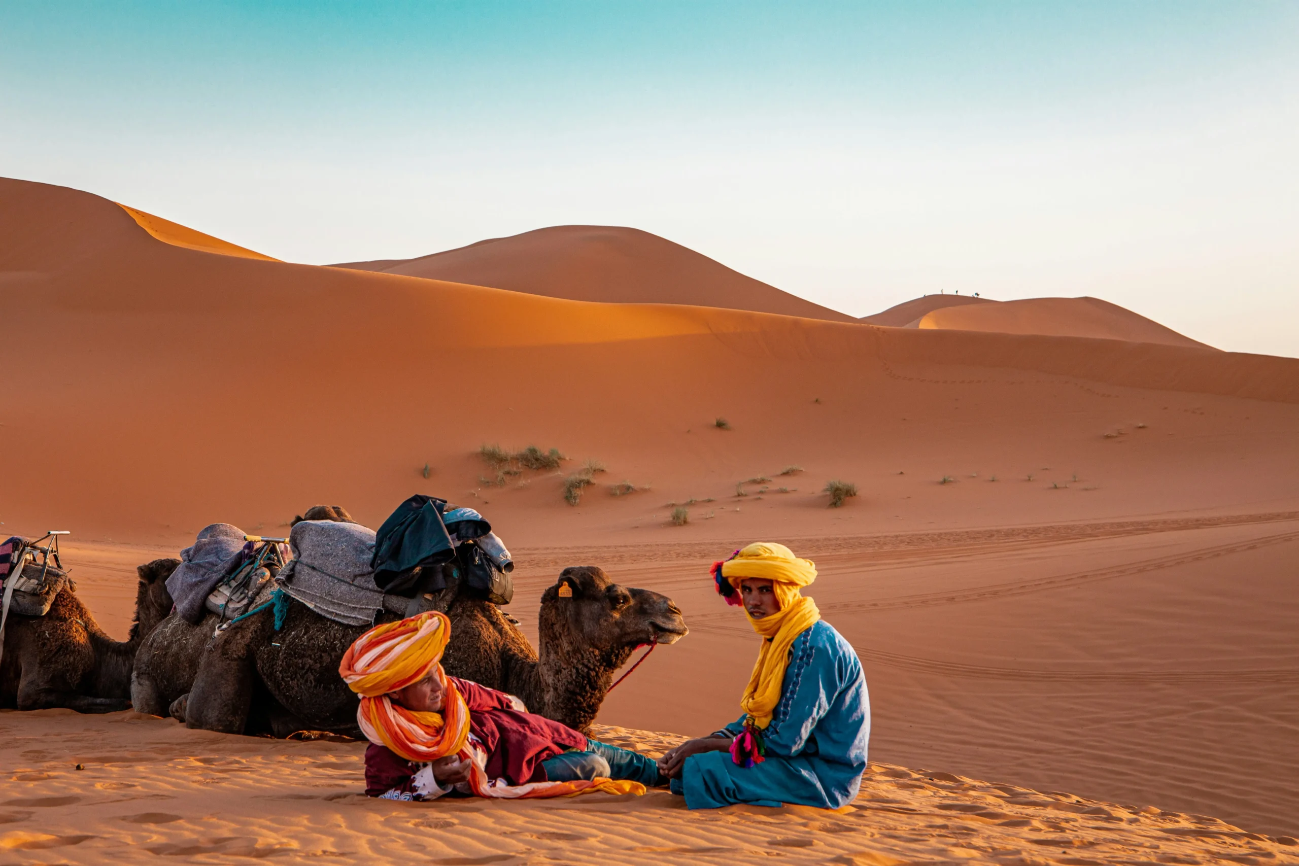 Merzouga Desert Tour – Camel Trek, Desert Camp & Sahara Sunrise golden sand dunes of Erg Chebbi at sunset Merzouga Morocco
